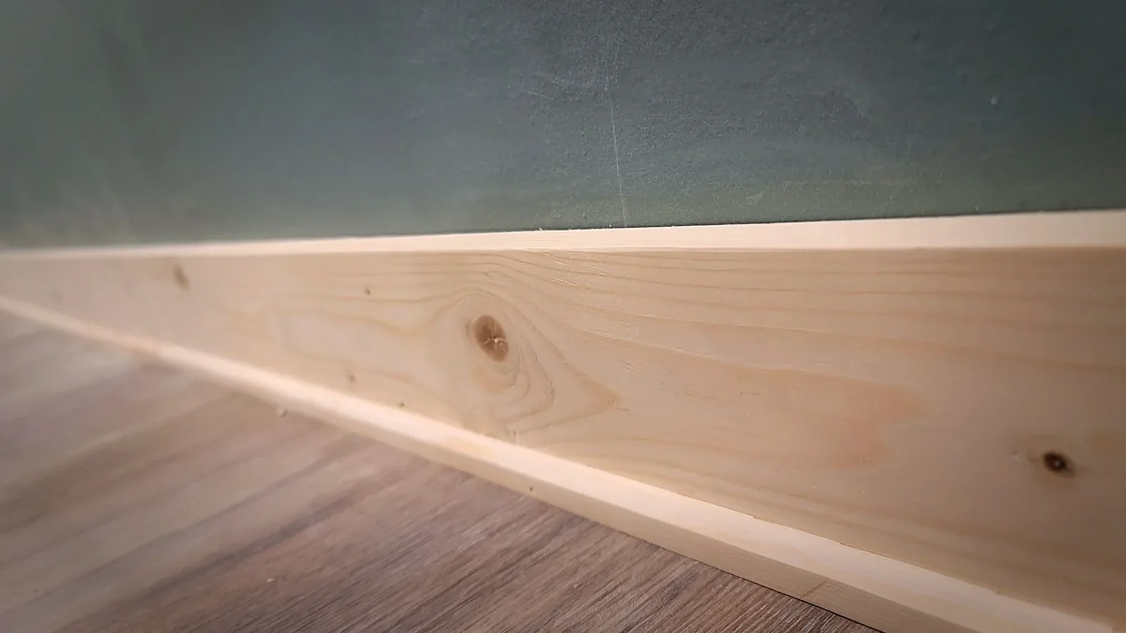 Close-up detail of mitered baseboard trim corner
