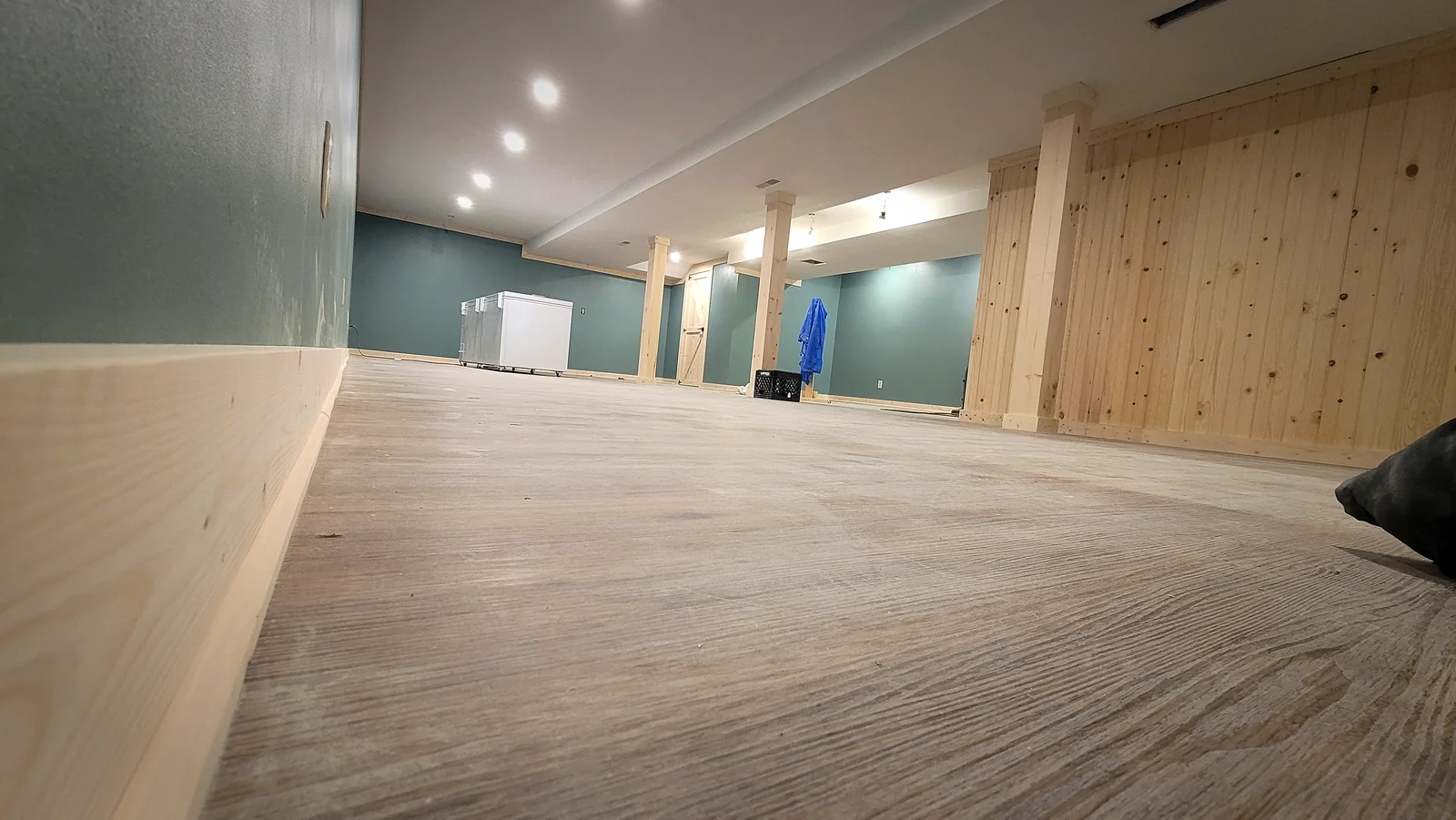 Wood-clad accent wall with box-beam column