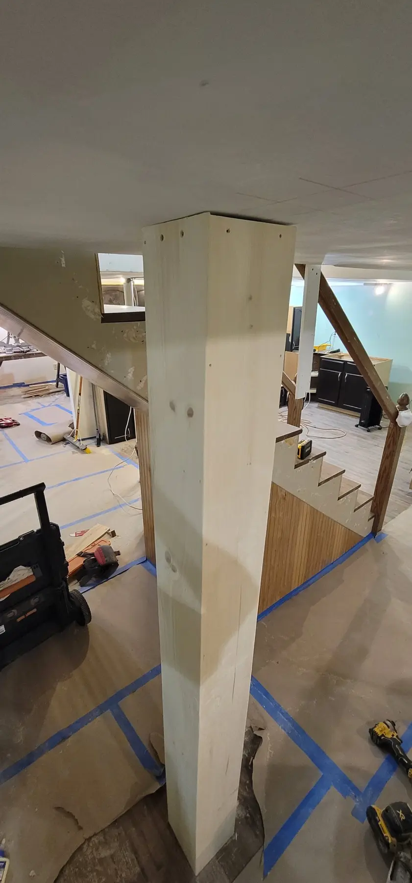Second box-beam column wrapped with cap trim