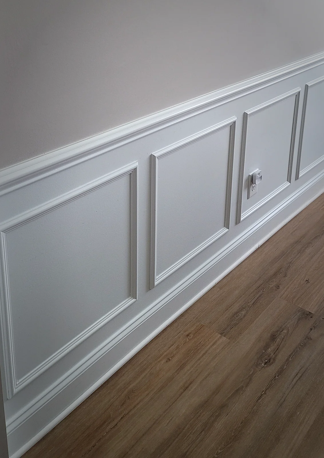 Recessed-panel wainscoting with crown and baseboard trim