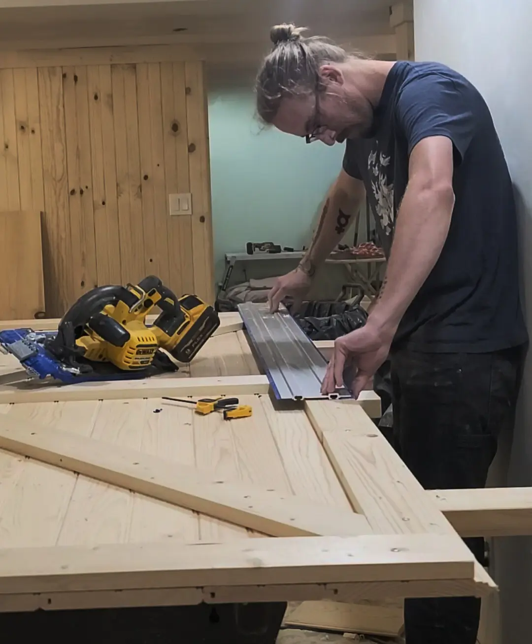 Hayden Riggs cutting pine panel stock for a built-in door